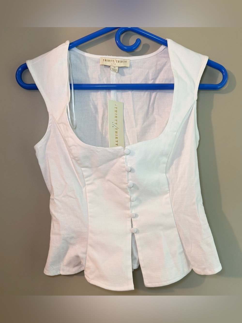 White Sleeveless Button-Front Peplum Top